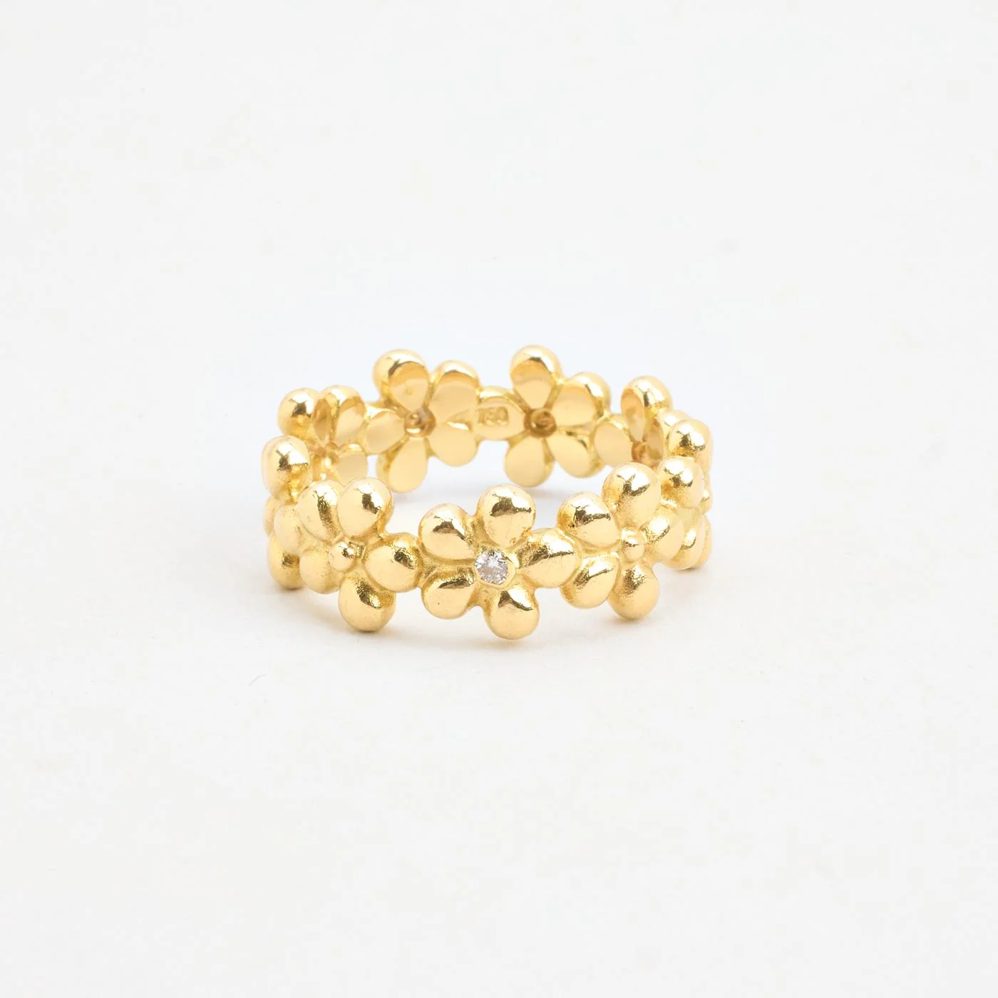 Blomsterring med diamant (0.03 ct) i 18K guld strl. 19.7 / strl. 62